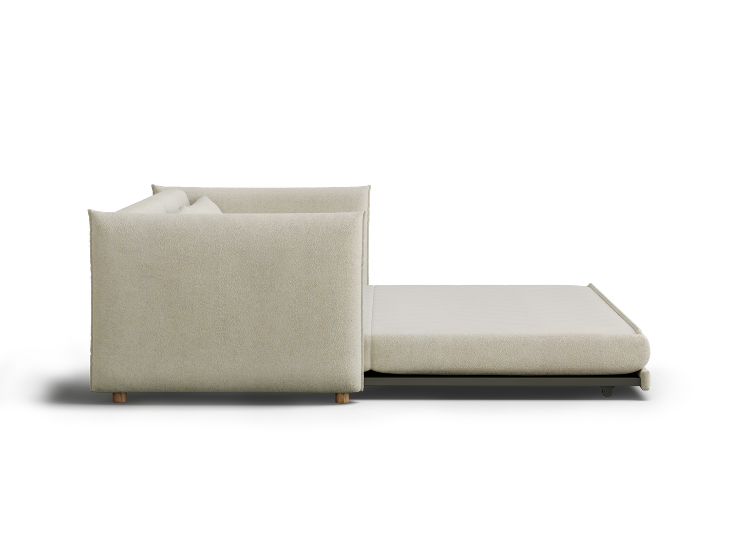 A minimalist, light beige sofa with a low back and plush cushions, featuring an extendable, fold-out bed component.