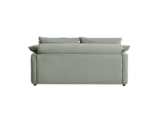 A light green sofa with soft back cushions, featuring clean lines and a textured fabric, against a black background.